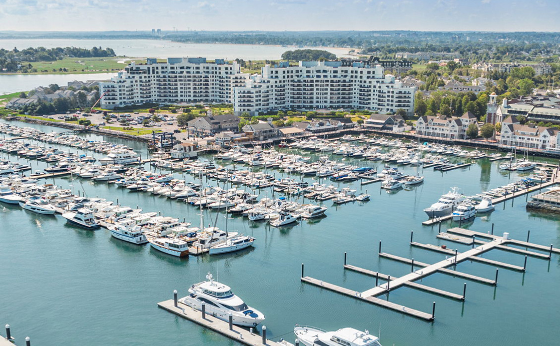 Several boats moored in a harbor.